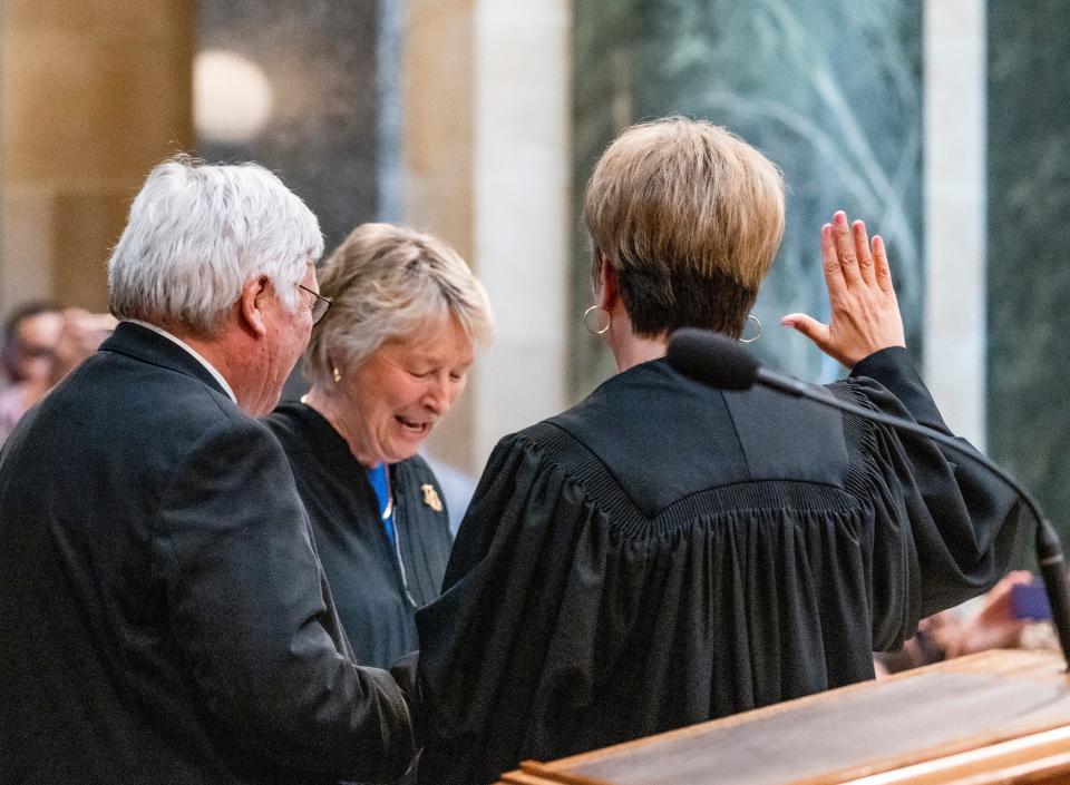 (Center) Wisconsin Supreme Court Justice Ann Walsh Bradley swears in (right) Justice Janet Protasiewicz to the Wisconsin Supreme Court as she is joined by her husband (left) Greg Sell on Tuesday, Aug. 1, 2023, at the Wisconsin State Capitol in Madison. Bradley will retire from the court in July 2025.