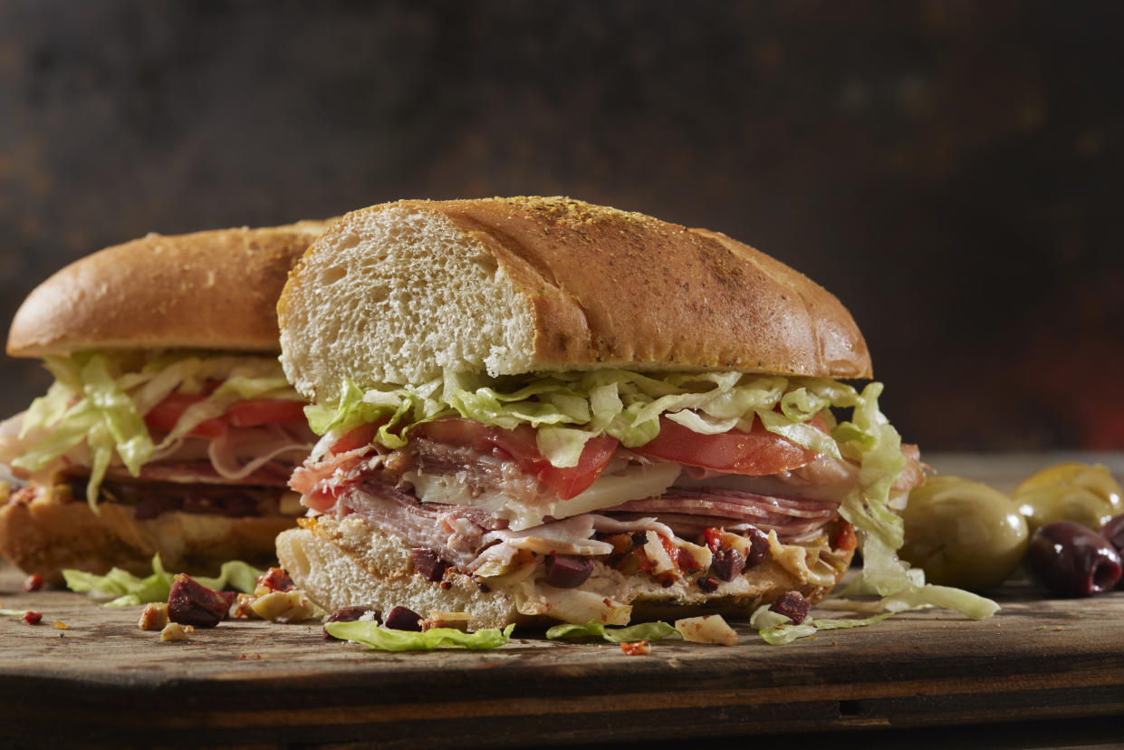 Muffuletta, Italian Sandwich with Olive , Roasted Peppers and Artichoke Spread. Ham, Salami, Prosciutto, Lettuce Tomato and Provolone Cheese.