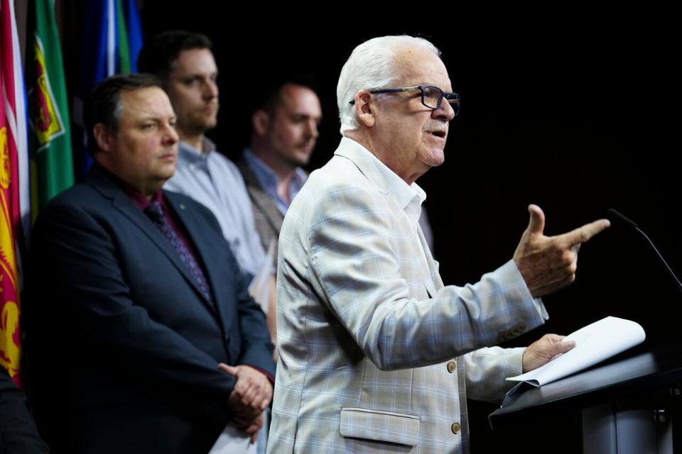 Public Service Alliance of Canada (PSAC) National President Chris Aylward joins fellow union leaders during a news conference in Ottawa on May 8, 2024.
