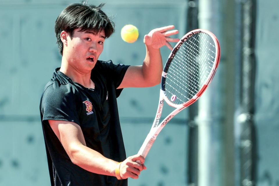 David Kang of Palm Desert High hits a return during his first-round CIF-SS Division 1 singles match against Edison High of Huntington Beach in Palm Desert, Calif., on Wed., May 1, 2024.