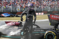 Mercedes driver Lewis Hamilton of Britain leaves his car after crashing with Red Bull driver Max Verstappen of the Netherlands during the Italian Formula One Grand Prix, at Monza racetrack, in Monza, Italy, Sunday, Sept.12, 2021. (AP Photo/Luca Bruno)