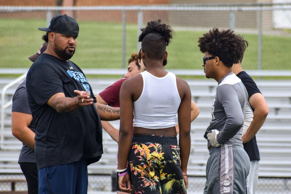 East Stroudsburg North head football coach Rick Altreche speaks to a group of players during the team's voluntary summer workout in Dingmans Ferry on Friday, July 30, 2021.