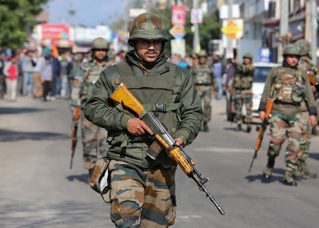 Indian Army soldiers patrol a street during a curfew in Jammu, February 16, 2019. REUTERS/Mukesh Gupta