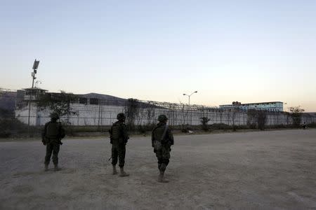 Soldiers patrol outside the Topo Chico prison in Monterrey, Mexico, February 11, 2016. REUTERS/Daniel Becerril