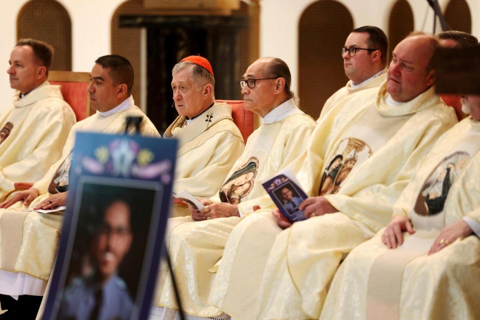 Cardinal Blase Cupich (third from left) attended the funeral for Huesca on Monday (Antonio Perez/Chicago Tribune via AP)