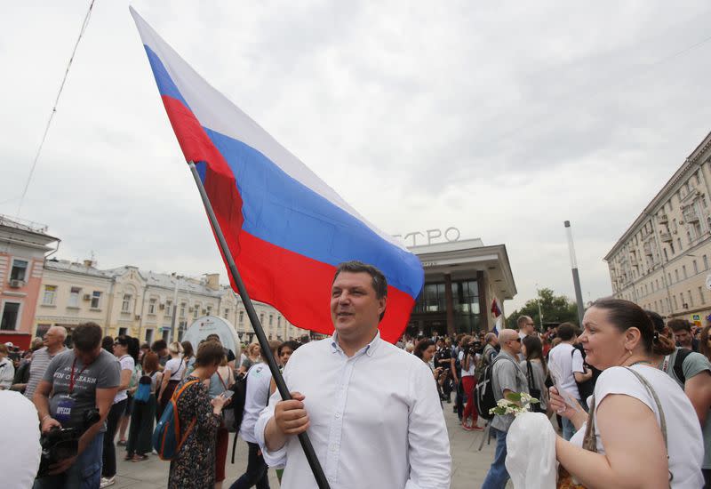 FILE PHOTO: People attend a rally in support of Russian investigative journalist Ivan Golunov in Moscow