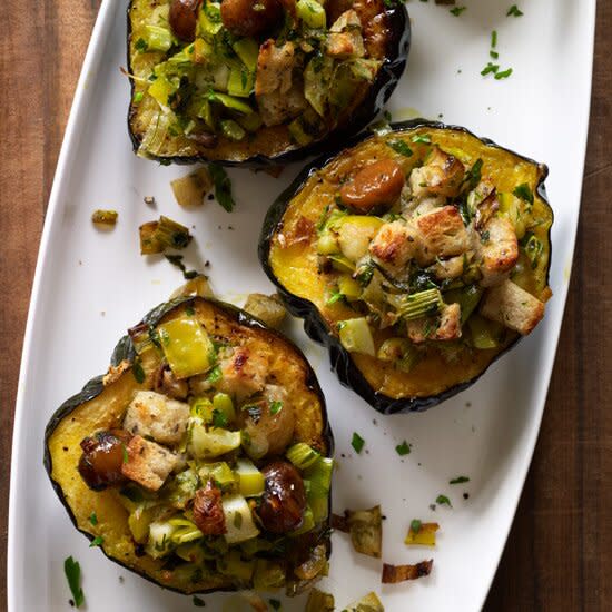 <p>Halved acorn squash make perfect single-serving bowls. These make a great vegetarian main course for any winter holiday, but they’re also a festive accompaniment to turkey, ham or roast goose.</p><p><a href="https://www.foodandwine.com/recipes/baked-acorn-squash-with-chestnuts-apples-and-leeks" rel="nofollow noopener" target="_blank" data-ylk="slk:GO TO RECIPE;elm:context_link;itc:0;sec:content-canvas" class="link ">GO TO RECIPE</a></p>