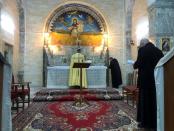 Iraqi monks pray during a mass at the Virgin Mary Church in Alqosh