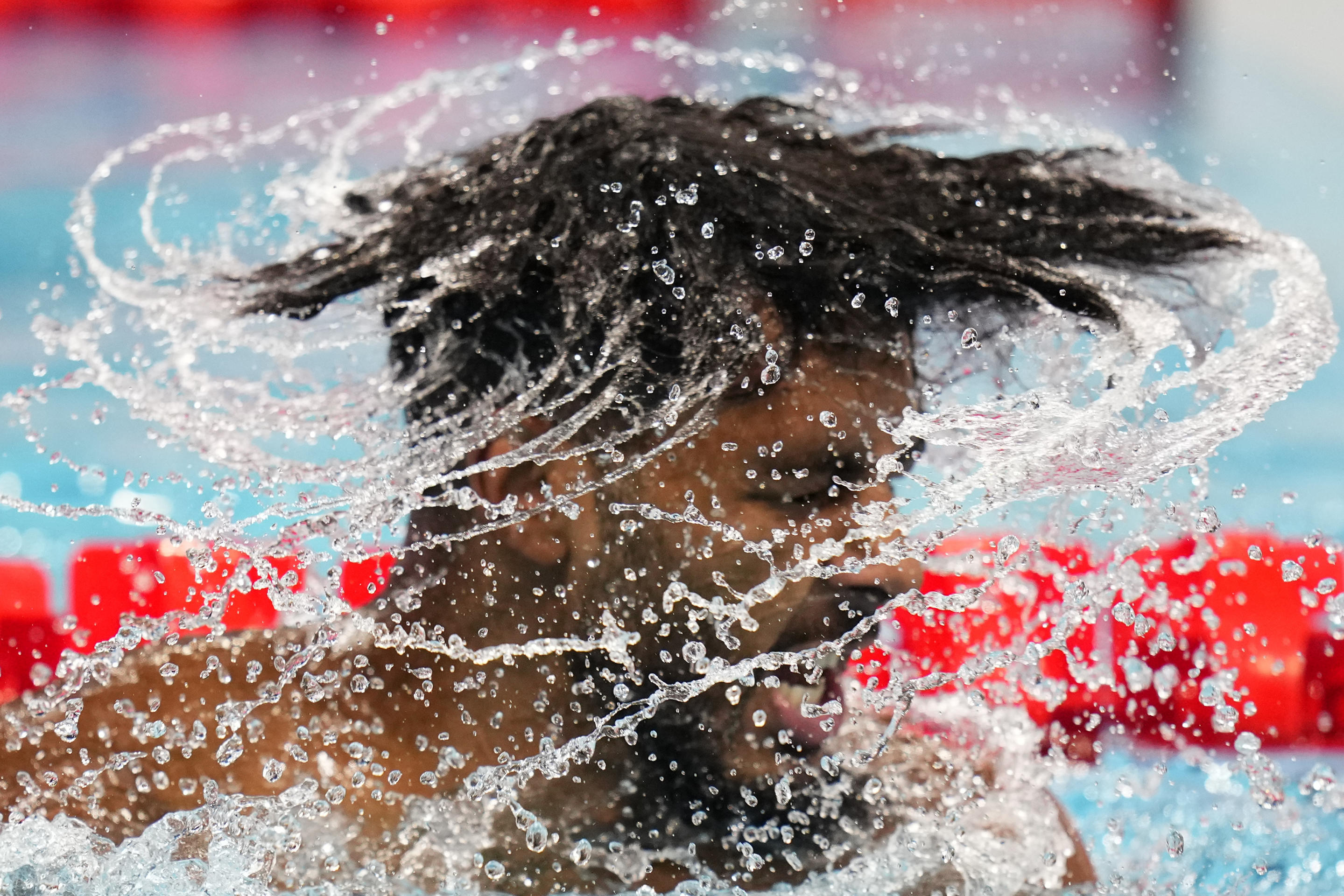 Saud Ghali, of Bahrain, reacts as he takes his cap off following his heat in the men's 200-meter breaststroke at the 2024 Summer Olympics on July 30, 2024, in Nanterre, France. (Petr David Josek/AP