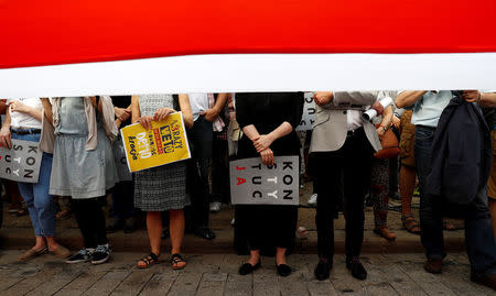 FILE PHOTO: People attend a protest against judicial reforms in Warsaw, Poland, July 24, 2017. REUTERS/Kacper Pempel/File Photo