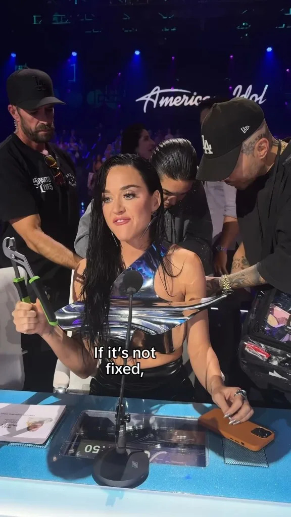 “My top broke #idol,” Perry captioned a behind-the-scenes Instagram video of herself being tended to by several crew members. @katyperry/Instagram