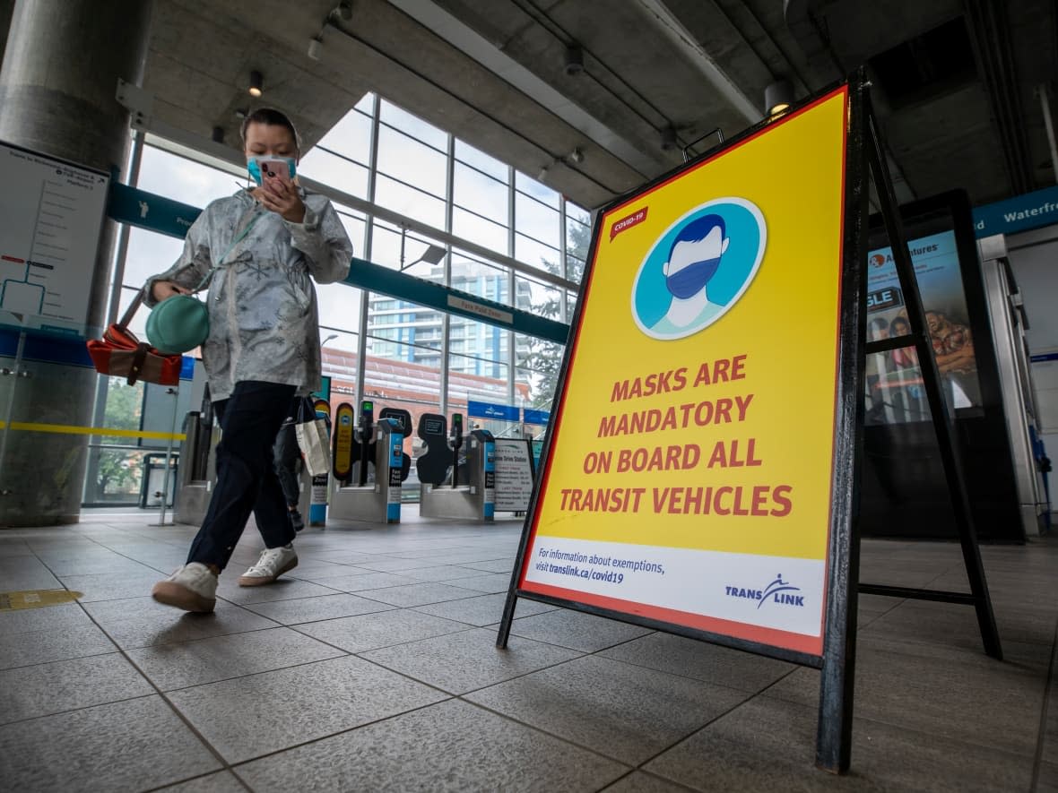 A transit passenger wearing a mask is pictured in Vancouver in August 2020.  (Ben Nelms/CBC - image credit)