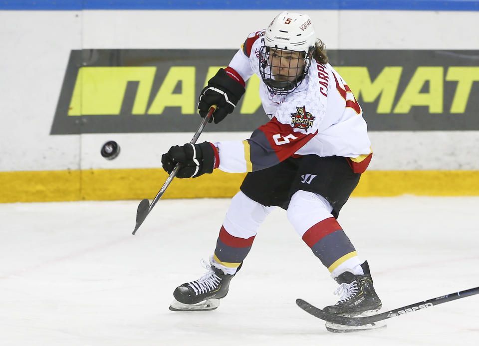 This photo provided by KHL-Marketing shows Alexandra Carpenter as she plays hockey for the KRS Vanke Rays on Oct. 15, 2019 in Ufa, Russia. Carpenter, college hockey's top player in 2015 and daughter of former NHL star Bobby Carpenter, is leading Russia's Women's Hockey League in scoring while playing for the Chinese-based Shenzhen KRS Vanke Rays. (Sadykova Svetlana/KHL-Marketing via AP)