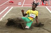 <p>Jamaica's Tajay Gayle competes in the men's long jump final during the Tokyo 2020 Olympic Games at the Olympic Stadium in Tokyo on August 2, 2021. (Photo by Andrej ISAKOVIC / AFP)</p> 