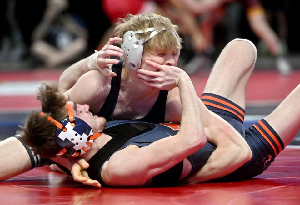 Illinois’ Justin Cardani tries to push away Penn State’s Braeden Davis in a 125 lb first round match of the Big Ten Wresting Championships at the Xfinity Center at the University of Maryland on Saturday, March 9, 2024.