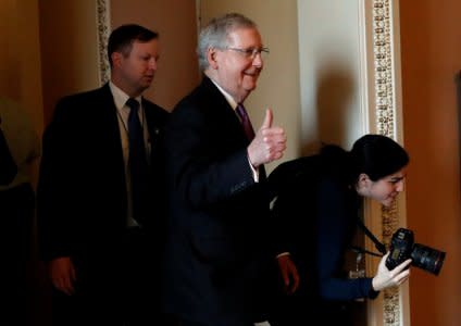 U.S. Senate Majority Leader Mitch McConnell (R-KY) gestures to reporters after lawmakers struck a deal to reopen the federal government three days into a shutdown on Capitol Hill in Washington, U.S., January 22, 2018. REUTERS/Leah Millis