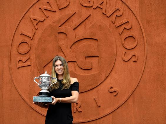 The Romanian finally got her hands on the The Suzanne Lenglen Cup last year (AFP/Getty Images)