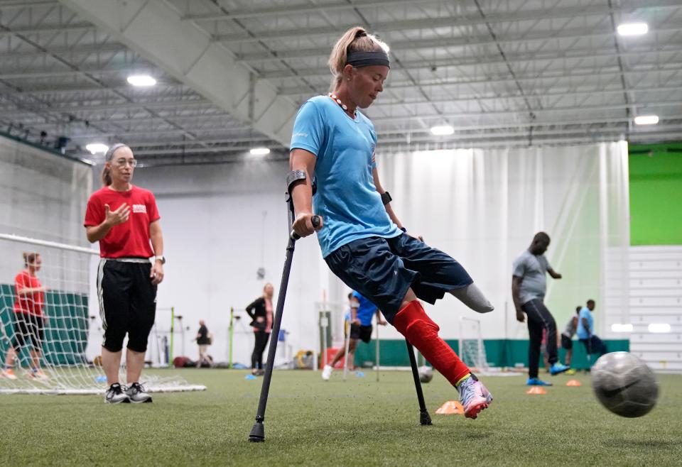 Katie Bondy kicks a ball during practice at TOCA in Lewis Center. Adaptive Sports Connection founded the amputee soccer team for which Bondy plays.