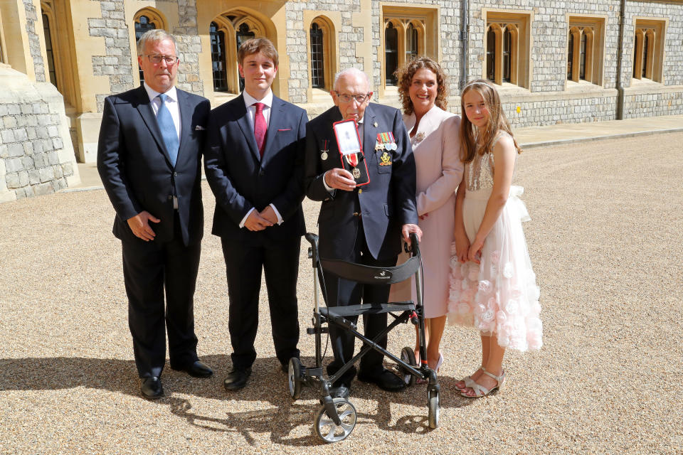 WINDSOR, ENGLAND - JULY 17: Captain Sir Thomas Moore poses with his family after being awarded with the insignia of Knight Bachelor by Queen Elizabeth II at Windsor Castle on July 17, 2020 in Windsor, England. British World War II veteran Captain Tom Moore raised over £32 million for the NHS during the coronavirus pandemic.  (Photo by Chris Jackson/Getty Images)