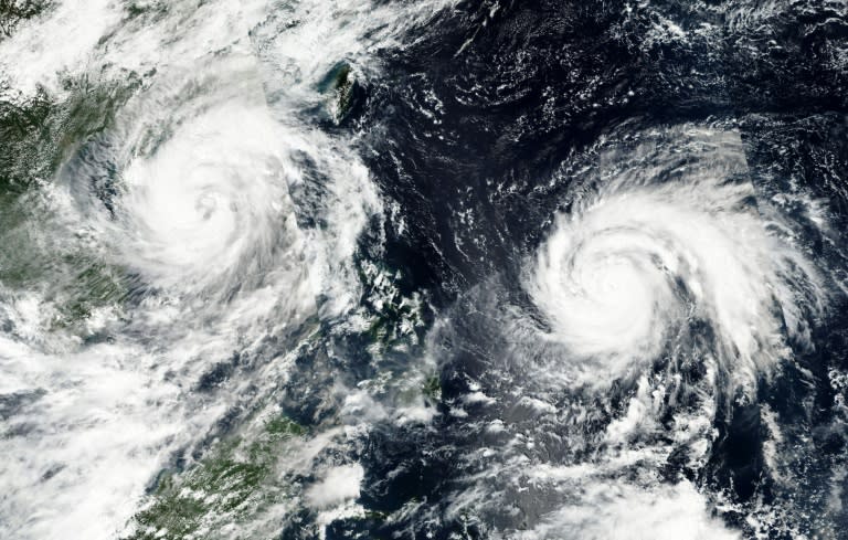 Typhoon Sarika (L) is seen approaching southern China and Vietnam followed closley by Typhoon Haima, on October 17, 2016