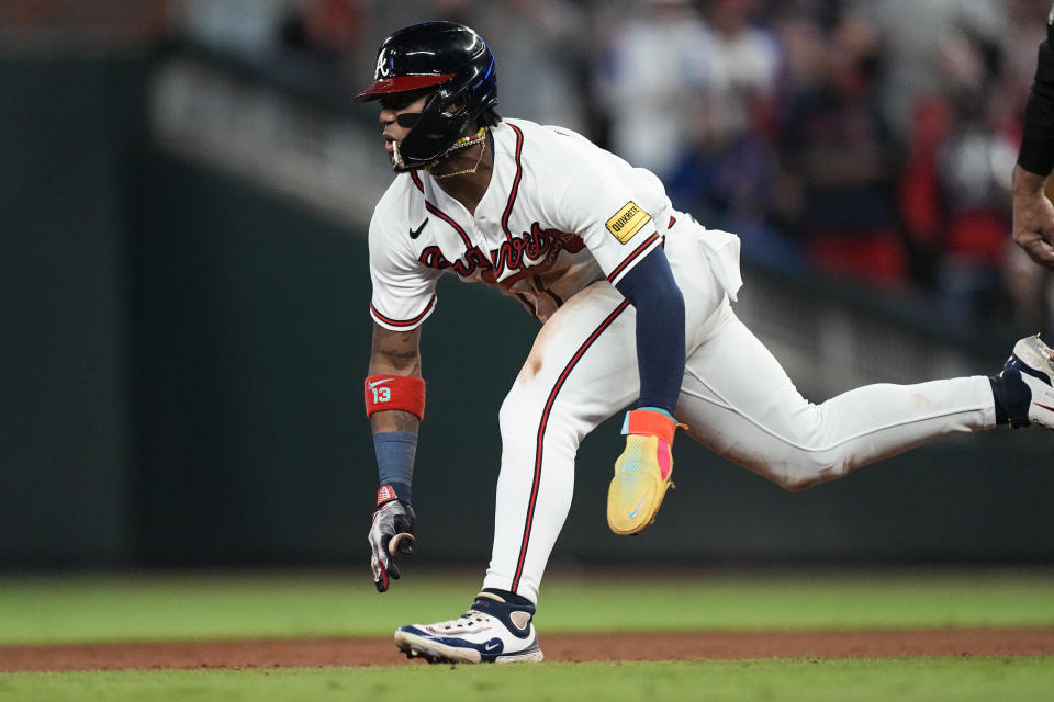 Atlanta Braves' Ronald Acuna Jr. steals second base in the 10th inning of a baseball game against the Chicago Cubs, Wednesday, Sept. 27, 2023, in Atlanta. The stolen base was Acuna's 70th of the season. (AP Photo/John Bazemore)