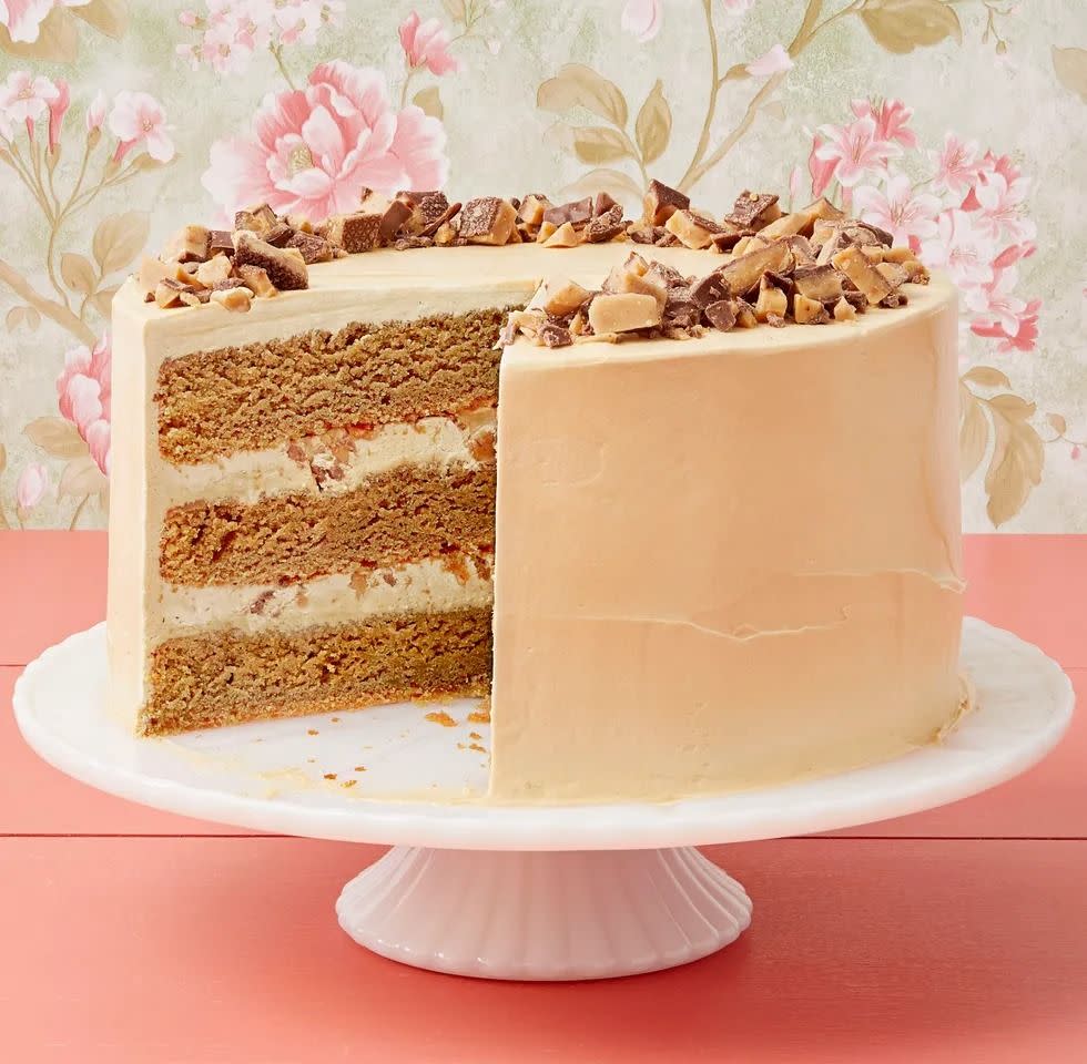 coffee toffee crunch cake frosted on cake stand