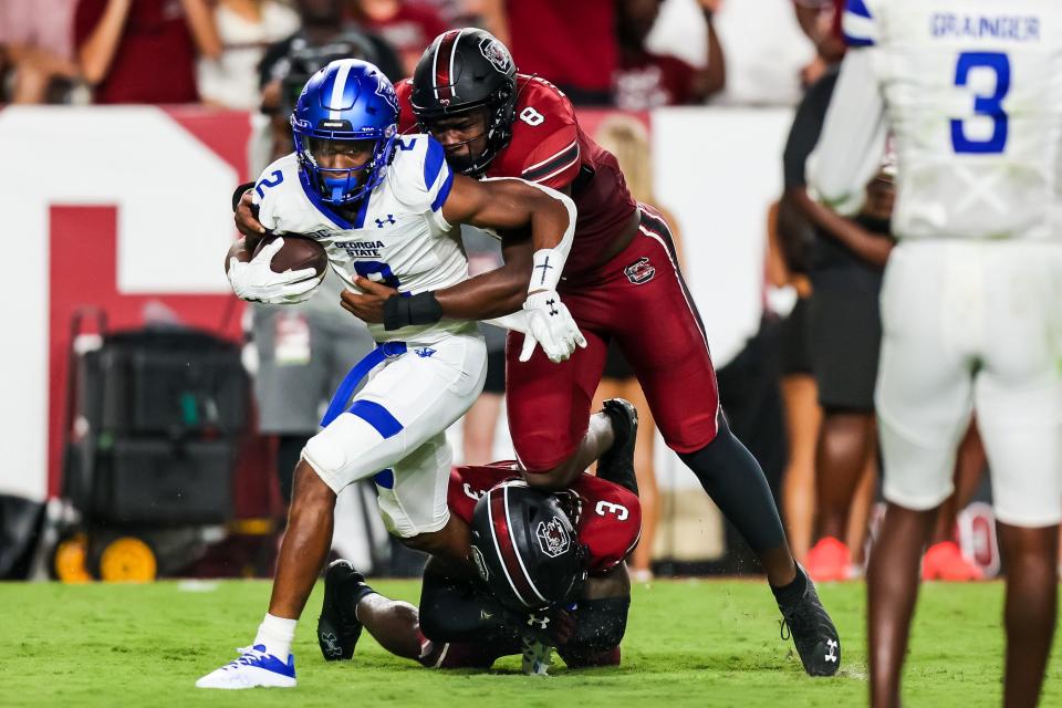 Sep 3, 2022; Columbia, South Carolina, USA; Georgia State Panthers wide receiver Jamari Thrash (2) is brought down by South Carolina Gamecocks linebacker Gilber Edmond (8) in the second quarter at Williams-Brice Stadium. Mandatory Credit: Jeff Blake-USA TODAY Sports