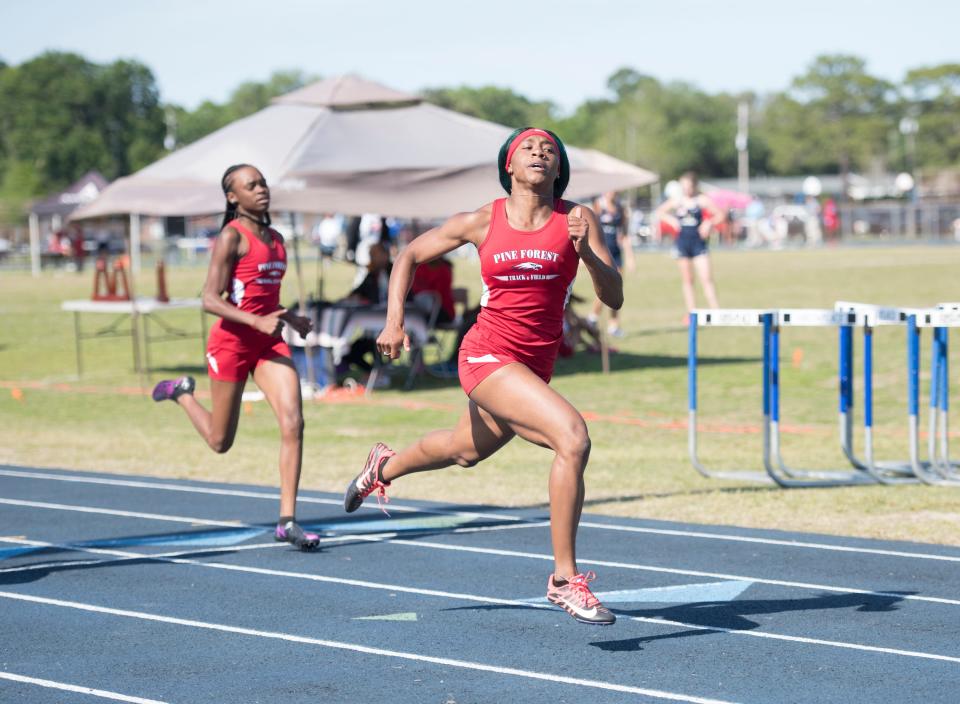 Pine Forest's Autaliah Williams-Gould crosses the finish line for a first place win in the Girls 200 Meter Dash during the 1-3A track and field championships at Booker T. Washington High School in Pensacola on Tuesday, April 16, 2019.