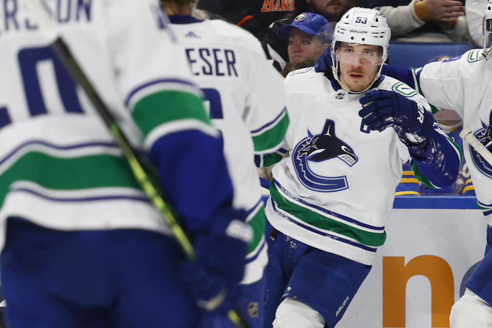 Vancouver Canucks center Bo Horvat (53) celebrates his goal during the second period of an NHL hockey game against the Buffalo Sabres, Tuesday, Nov. 15, 2022, in Buffalo, N.Y. (AP Photo/Jeffrey T. Barnes)