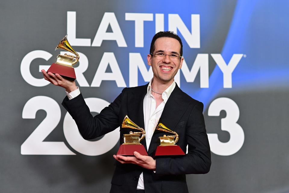 Edgar Barrera poses with the awards for best regional song, songwriter of the year and producer of the year at the 24th Latin Grammy Awards on Nov. 16, 2023, in Seville, Spain.