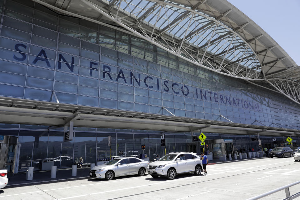 FILE - In this July 11, 2017, file photo, vehicles wait outside the international terminal at San Francisco International Airport in San Francisco. San Francisco International Airport is banning the sale of single-use plastic water bottles. The change will take effect Aug. 20, 2019 and will apply to airport restaurants, cafes and vending machines. (AP Photo/Marcio Jose Sanchez, File)