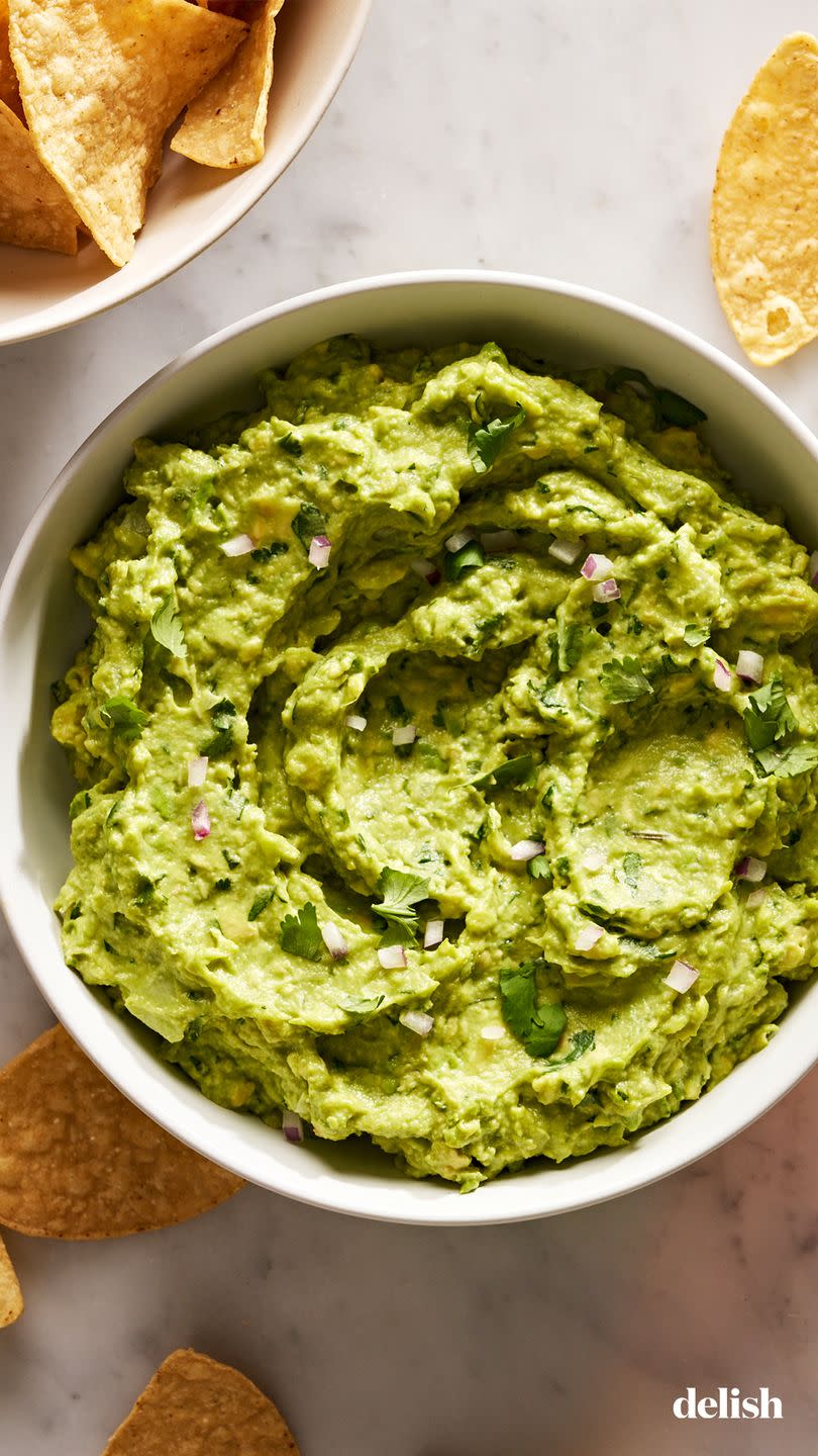 guacamole with diced red onion, cilantro, and with chips