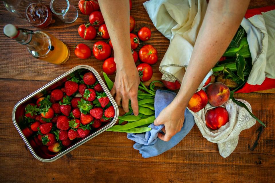 Anne-Marie Bonneau, the Zero Waste Chef, uptakes her groceries from the farmers market.