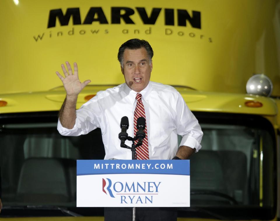 Republican presidential candidate, former Massachusetts Gov. Mitt Romney gestures while speaking at a campaign event at Integrity Windows in Roanoke, Va., Thursday, Nov. 1, 2012. (AP Photo/David Goldman)