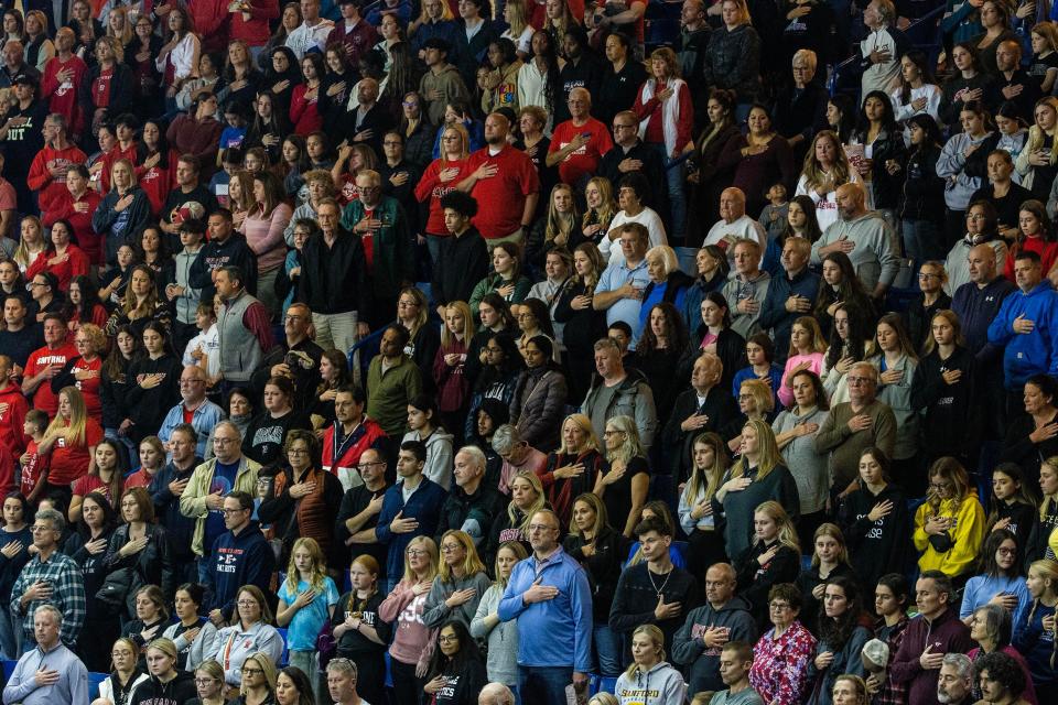 Fans stand for the national anthem at the start of the Smyrna High School vs. Ursuline Academy DIAA Girls Volleyball Tournament championship game at the Bob Carpenter Center in Newark, Thursday, Nov. 16, 2023. Smyrna won 25-14.