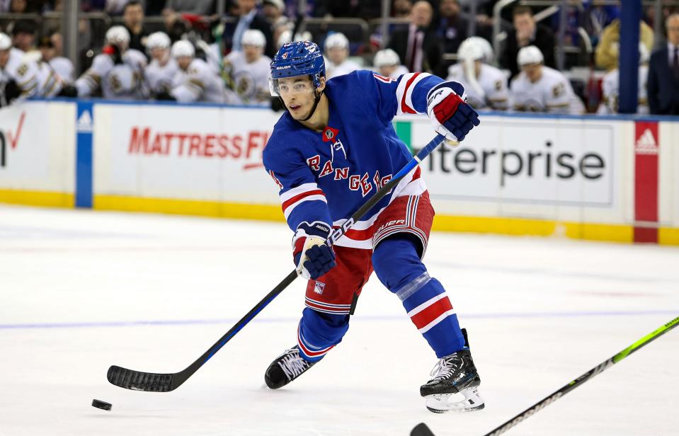 Nov 25, 2023; New York, New York, USA; New York Rangers defenseman Braden Schneider (4) passes the puck against the Boston Bruins during the second period at Madison Square Garden.