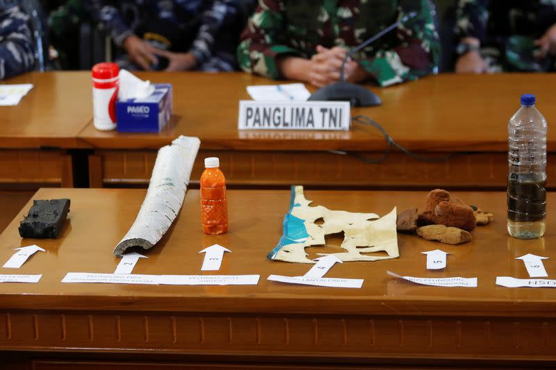 Debris from the missing submarine are displayed during media conference at Ngurah Rai Airport in Bali