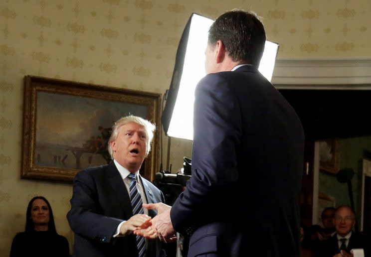 Trump greets Comey during a reception for law enforcement officers at the White House, Jan. 22, 2017. (Joshua Roberts/Reuters)