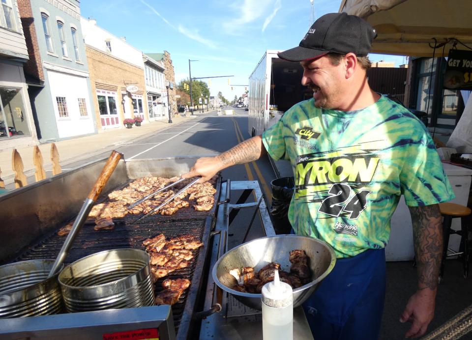 Michael Crabtree grills bourbon chicken at the 2021 Galion Oktoberfest.