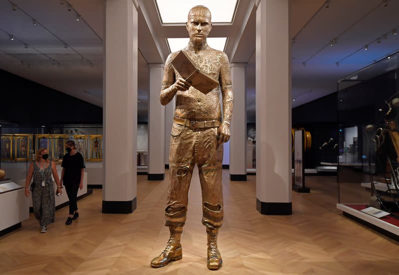 Employees clean exhibits ahead of the reopening of the Science Museum, in London, Britain