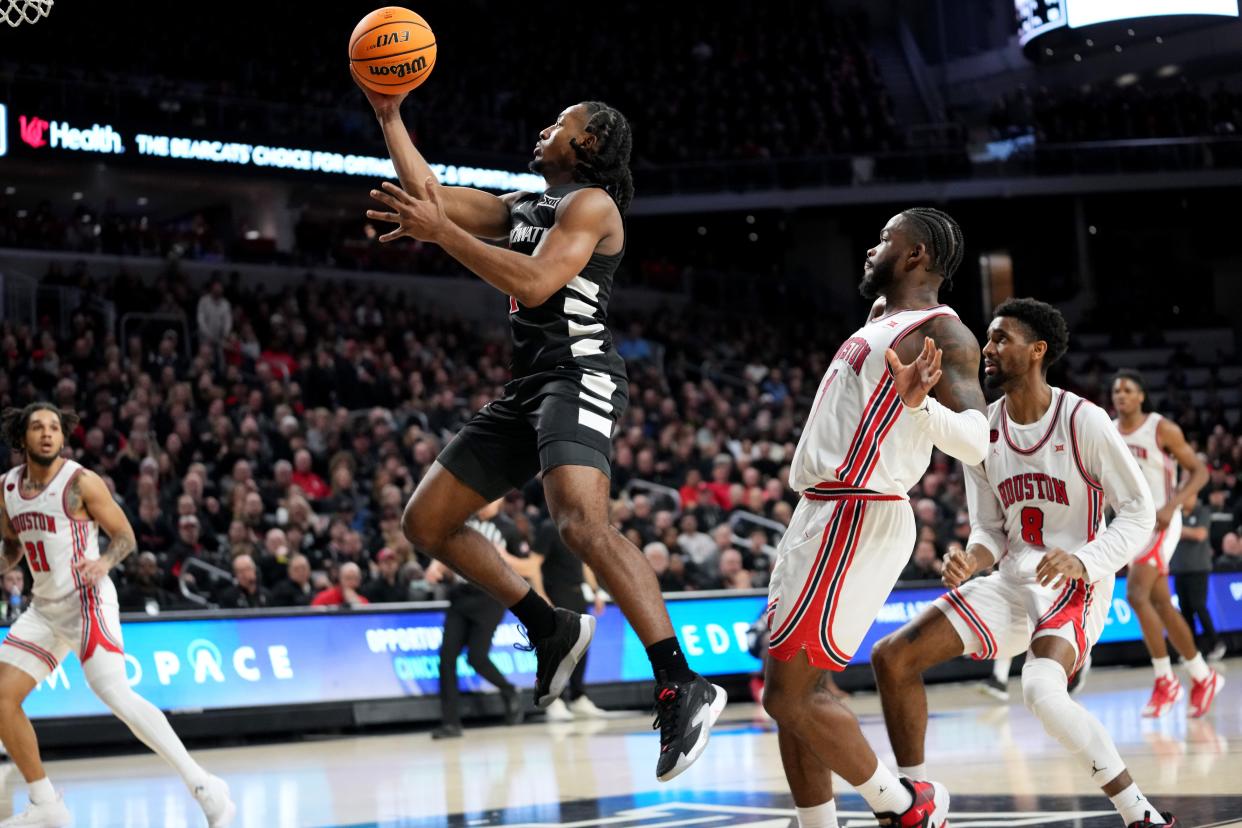 Day Day Thomas drives to the basket against Houston in UC's Feb. 10 game at Fifth Third Arena.