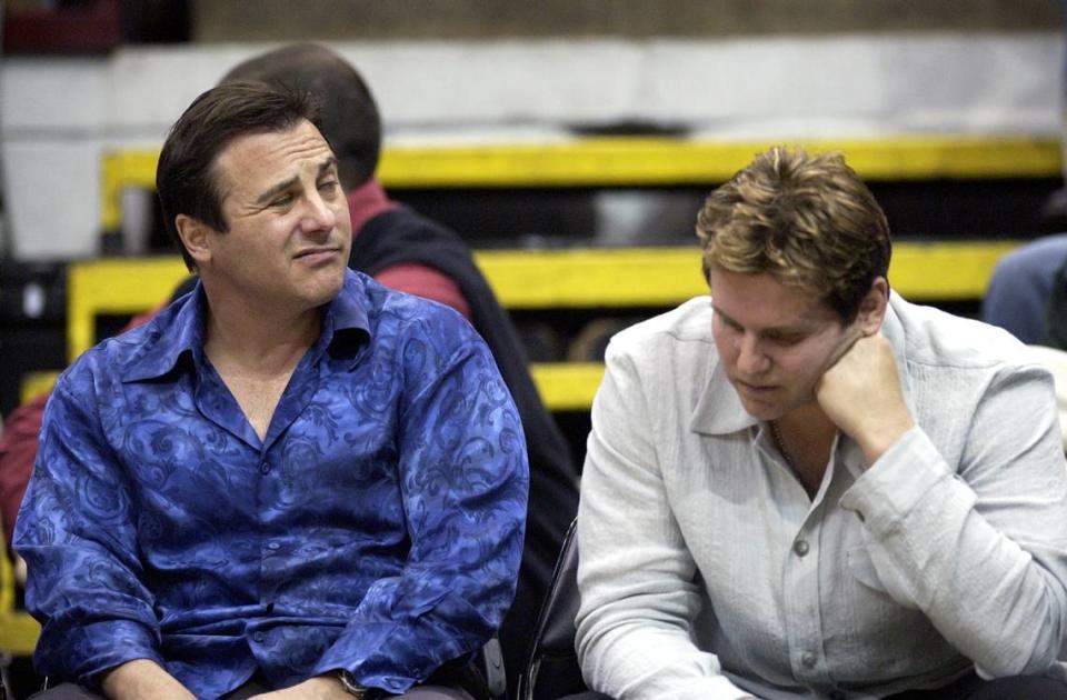 Gavin Maloof, left, and his brother Joe watch the action courtside in Game 2 of the second-round of the NBA Western Conference playoffs between the Sacramento Kings and the Minnesota Timberwolves at Target Center in Minneapolis, Minn., Saturday, May 8, 2004.