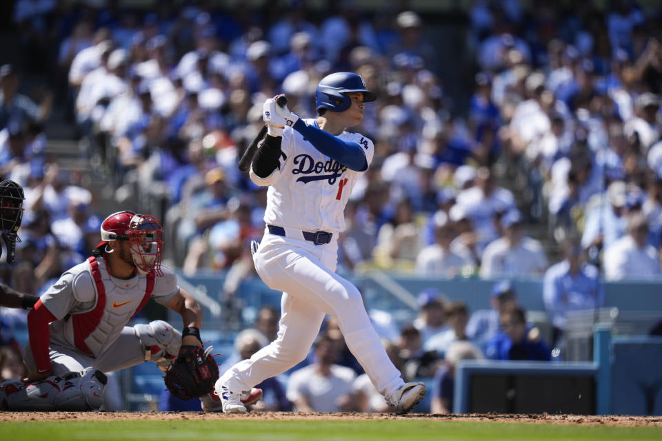 Los Angeles Dodgers' Shohei Ohtani hits a single during the fifth inning of a baseball game against the St. Louis Cardinals Thursday, March 28, 2024, in Los Angeles. (AP Photo/Jae C. Hong)