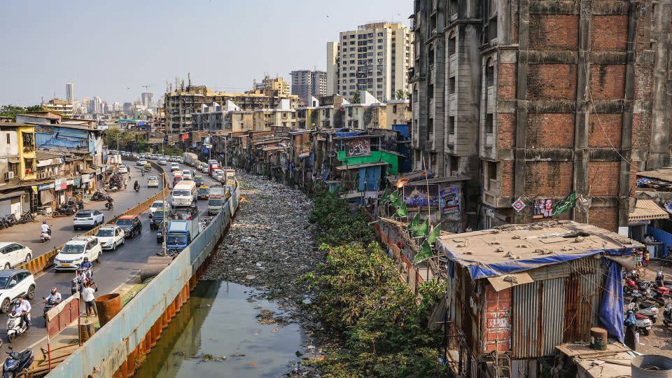 A sewage drain canal full of garbage is seen in Dharavi on April 18. - Noemi Cassanelli/CNN