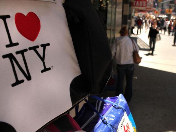 An ‘I love New York’ logo is displayed in Times Square (Getty)