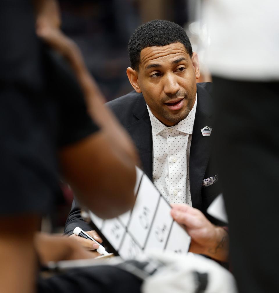 Missouri State head coach Dana Ford talks to his team during a Missouri Valley Conference Tournament game against Southern Illinois, Friday, March 3, 2023, at Enterprise Center in St. Louis. 