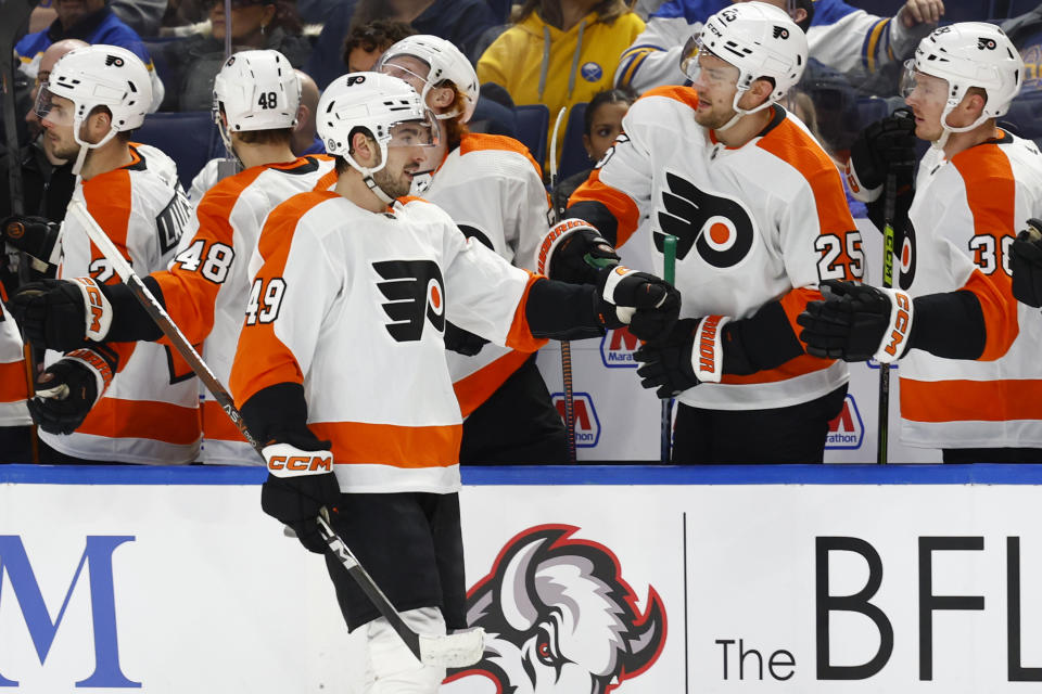 Philadelphia Flyers left wing Noah Cates (49) celebrates after his goal during the first period of an NHL hockey game against the Buffalo Sabres, Monday, Jan. 9, 2023, in Buffalo, N.Y. (AP Photo/Jeffrey T. Barnes)