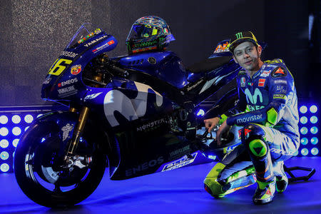 FILE PHOTO - Sport Motorcycling - Movistar Yamaha Team Presentation - Madrid, Spain - January 24, 2018 Movistar Yamaha's MotoGP rider Valentino Rossi of Italy poses with his new bike for the 2018 racing season. REUTERS/Susana Vera