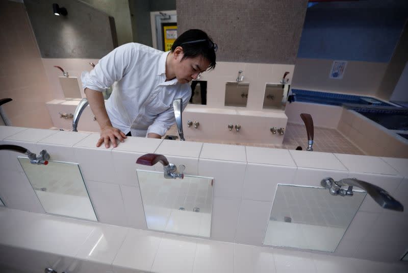 Tokuji Ito, the proprietor of a Japanese public bathhouse, prepares to open his facility in Tokyo