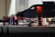 <p>Medical personnel and visitors gather at the nose of a transport plane carrying Otto Warmbier, a 22-year-old University of Virginia undergraduate student who was imprisoned in North Korea in March 2016, before he is transferred to an ambulance at Lunken regional airport, Tuesday, June 13, 2017, in Cincinnati, Ohio. (Photo: John Minchillo/AP) </p>